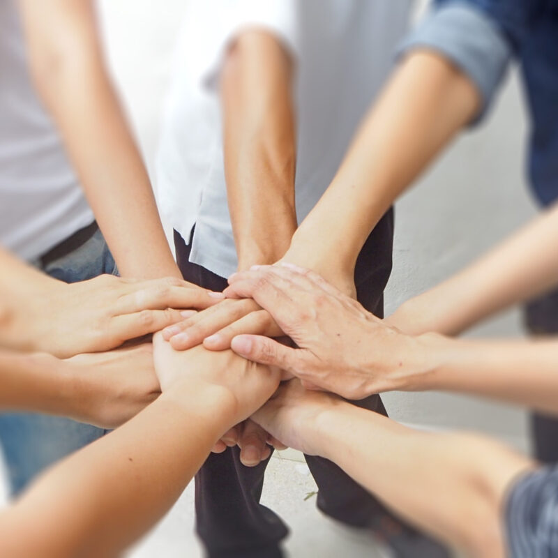 In selective focus of Business group  Hands together Joining teamwork concepts.Collaborate project.Cross processing and Split tone new trend like process